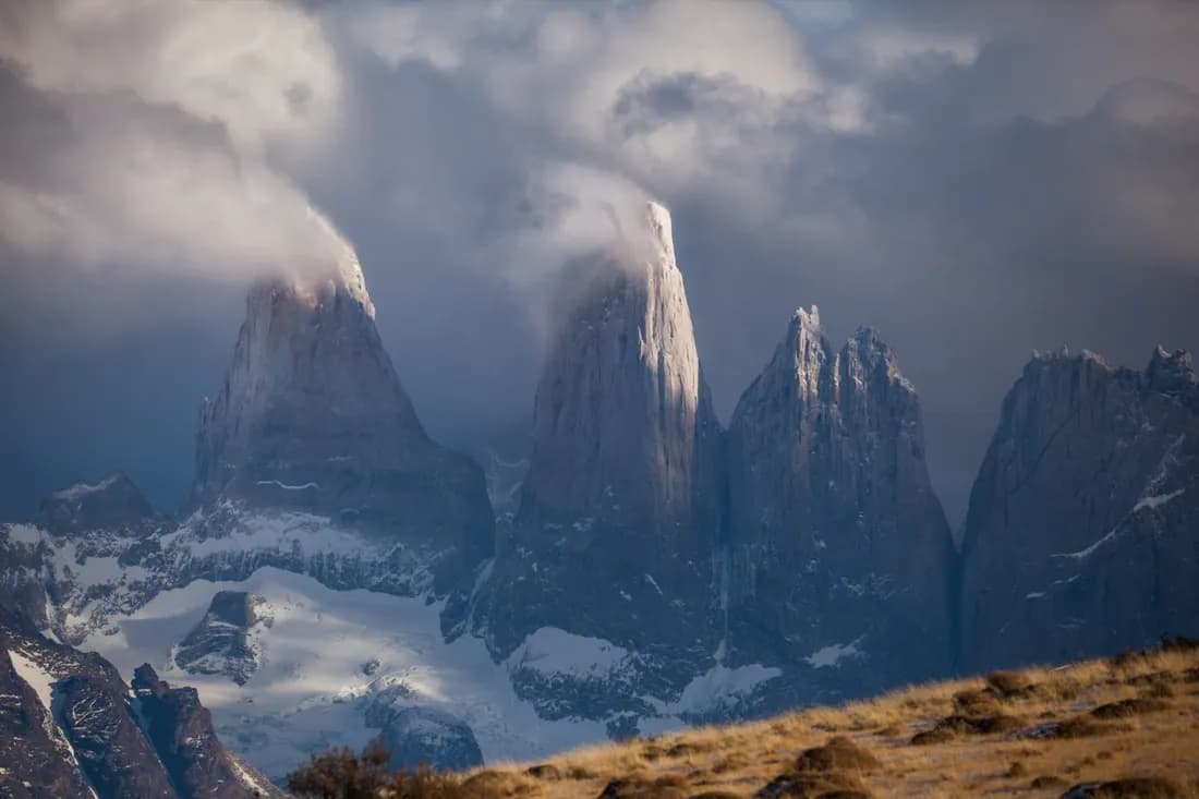 The towers emerging through winter cloud