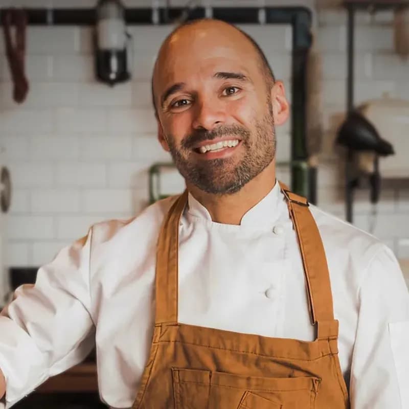 Chef Federico Ziegler smiling in his apron in the kitchen