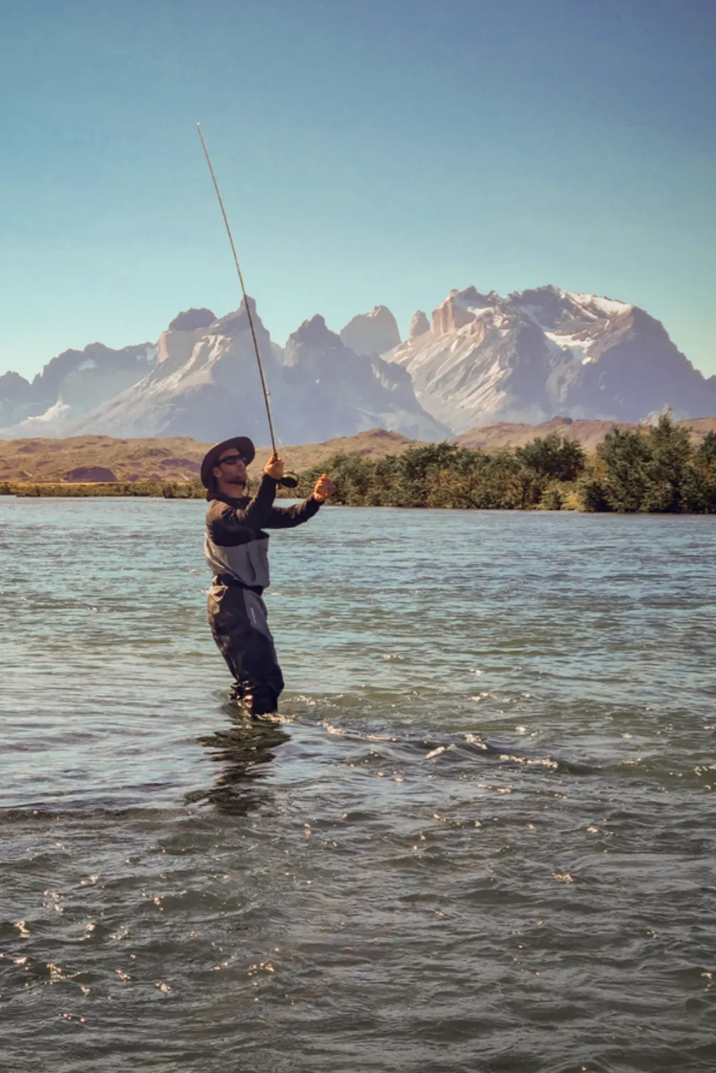 Fly-fishing with the Paine massif in the distance